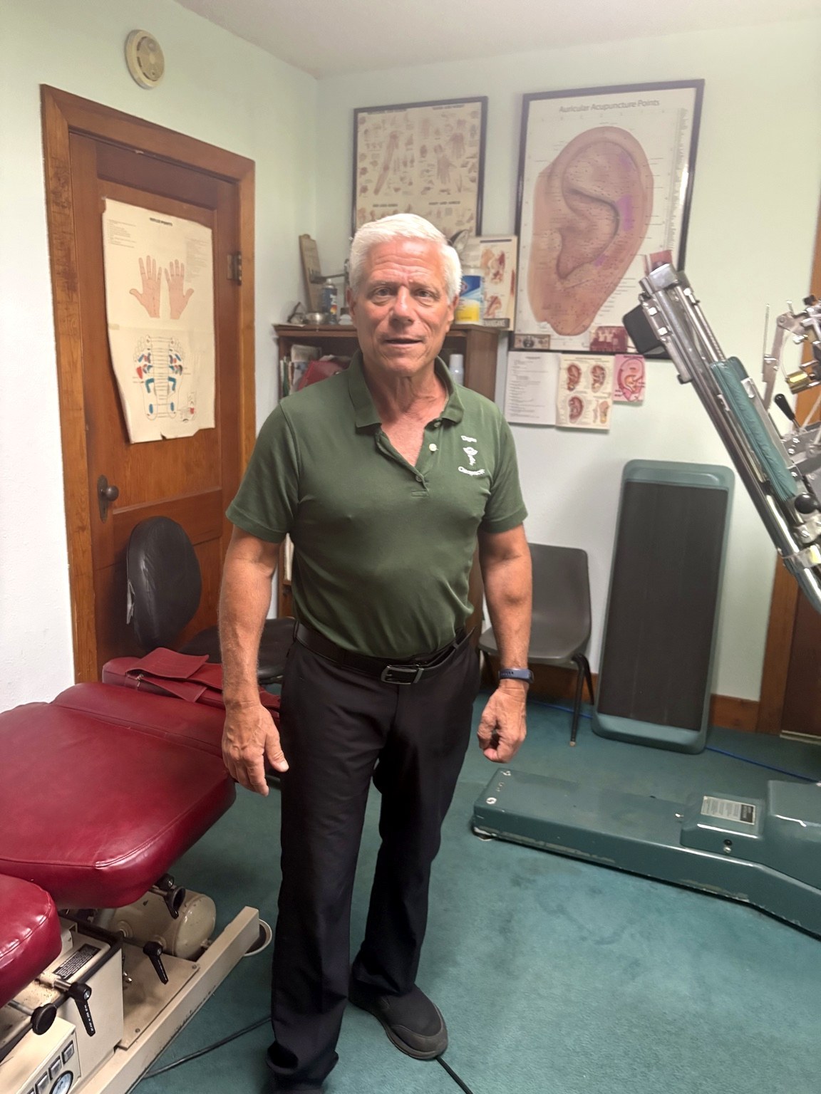 Doctor standing inside the chiropractic office.