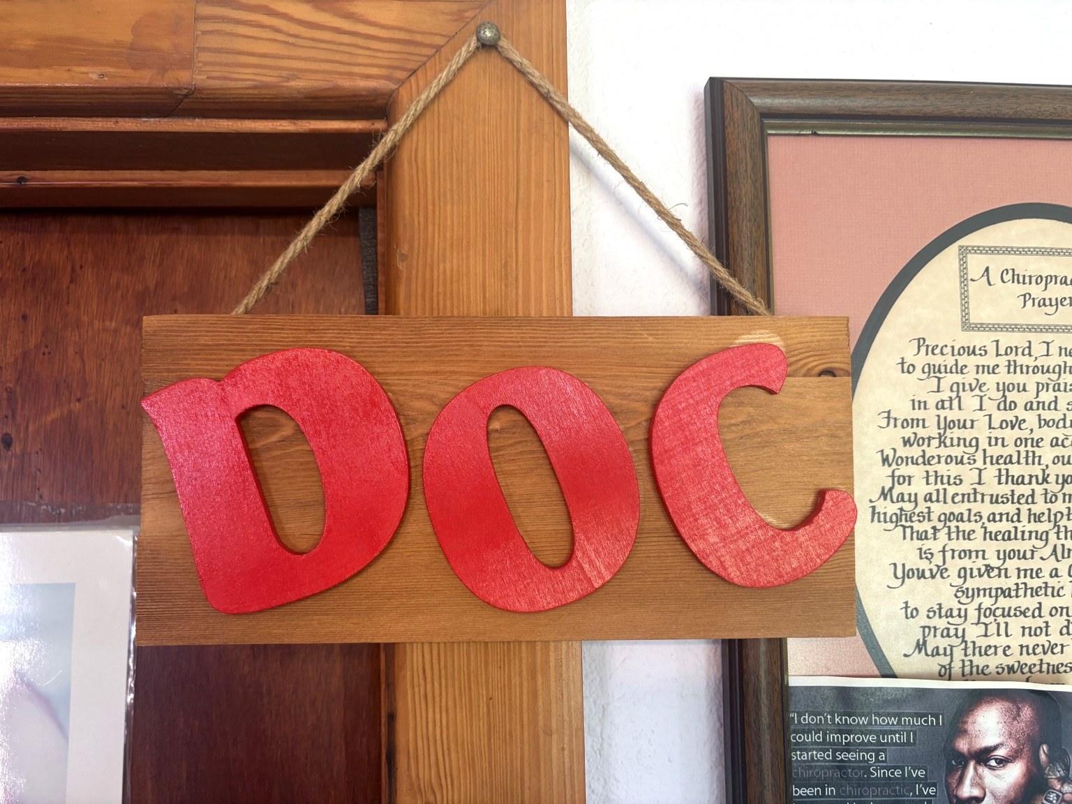 Wooden DOC sign inside the office.